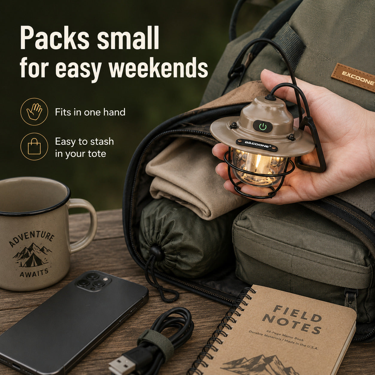 A hand holds a small camping lantern with a warm glowing light, shown next to an olive green backpack and camping accessories on a wooden table. Text on the image reads 'Packs small for easy weekends' with icons for one-hand fit and easy storage.